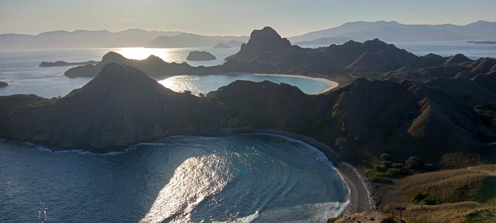 The stunning panoramic view from Padar Island, showcasing the three unique horseshoe bays and turquoise water.